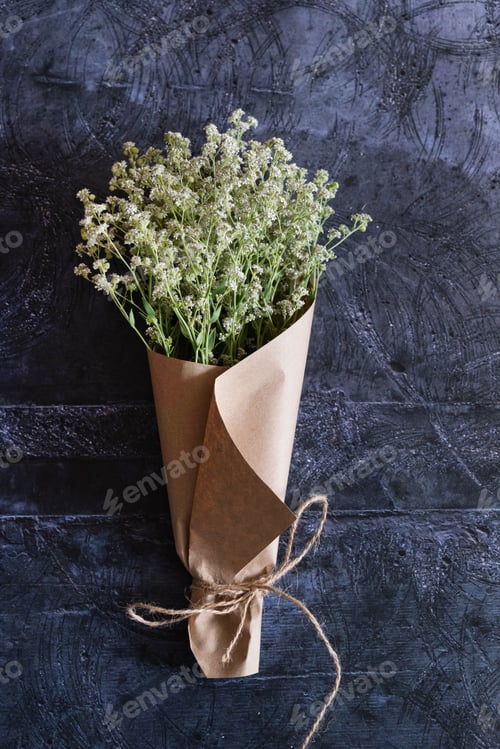 Preview: Gardener's in the flower shop make bouquet for a holiday. Family flower's business. Lifestyle flower