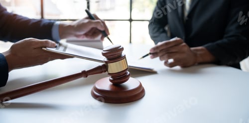 Preview: Law concept. Asian young lawyer or legal advisor explaining details Business contract agreement befo