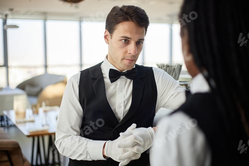 Preview: Young Adult Caucasian Man Listening Attentively to Colleague in Restaurant