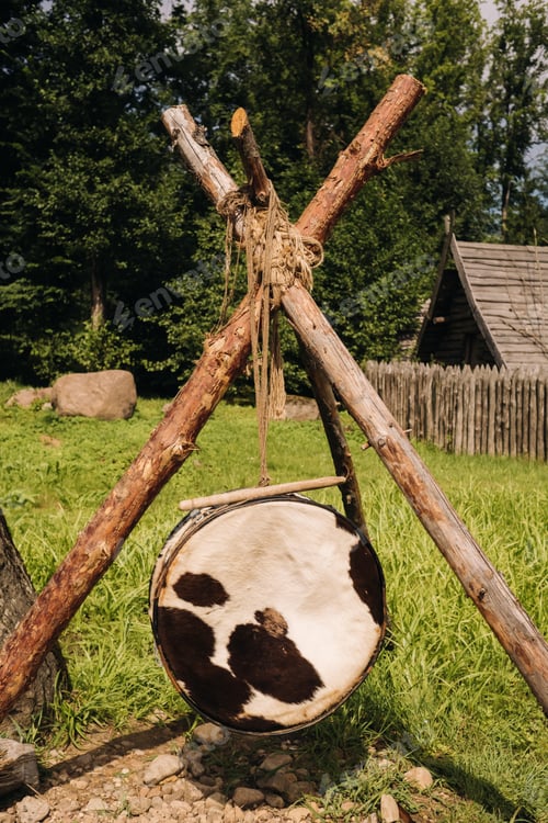 Preview: An old traditional drum with fur hanging in a medieval village