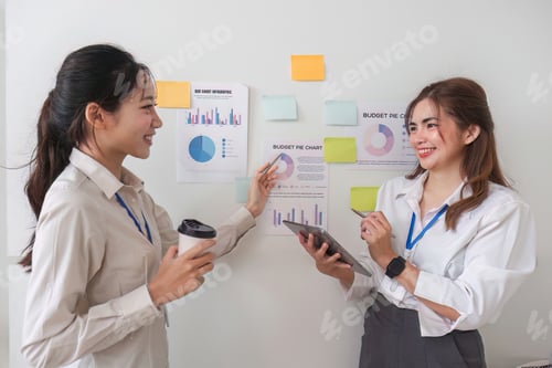 Preview: Casual creative happy two smile asian business people plan strategy analysis and brainstorm putting