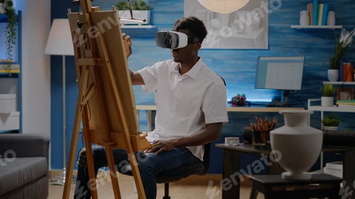 Preview: Artist of african american ethnicity using vr glasses for art
