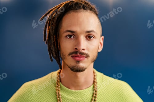 Preview: Close-up portrait of a young stylish man with dreadlocks