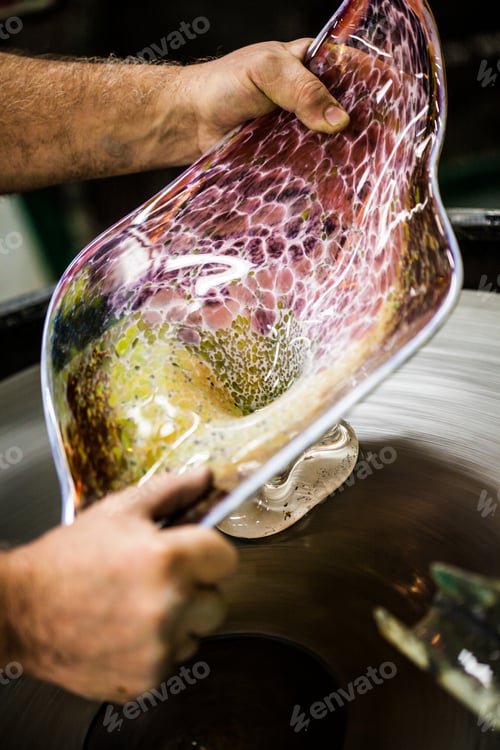 Preview: Man Working a Glass Blown Vase on Spinning Silica Sanding Disk