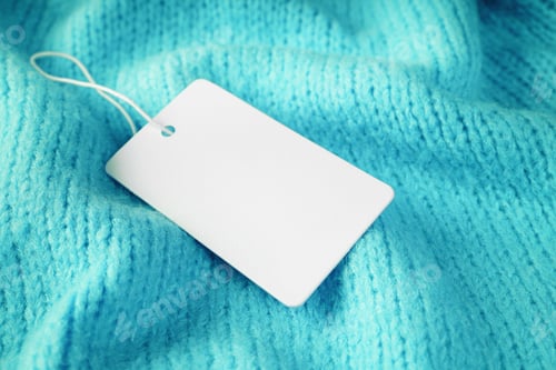 Preview: Template Of Blank Clothing Label, Price Tag On Turquoise Crumpled Knitted Sweater Background