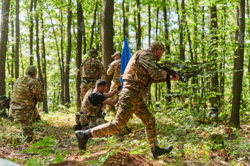 Preview: A disciplined and specialized military unit, donned in camouflage, strategically patrolling and