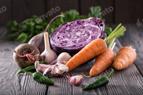 Preview: Vegetable still life on wooden table with wooden background