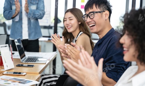 Preview: Happy asian business clapping hands after business meeting