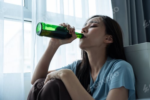 Preview: Asian young depression woman feeling heart broken and drinking beer.