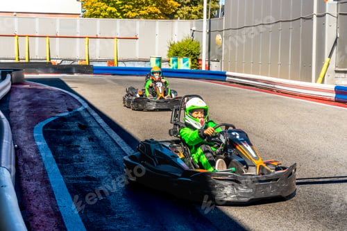 Preview: Children competing go kart racing on outdoor track
