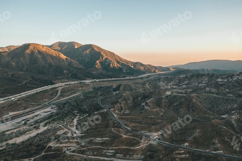 Preview: Aerial view over California Country Site Desert Mountains with Highway and Car traffic