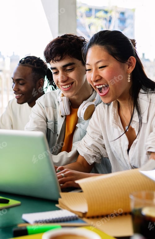 Preview: Diverse group of happy high school students studying together on campus