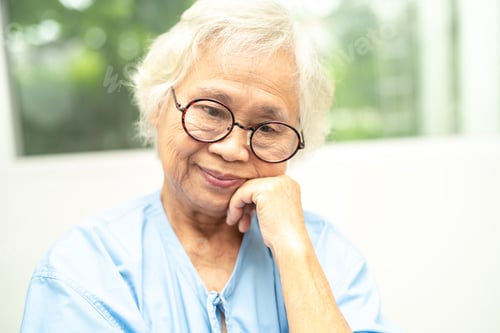 Preview: Asian senior woman wearing eyeglasses or vision glasses at home care service.