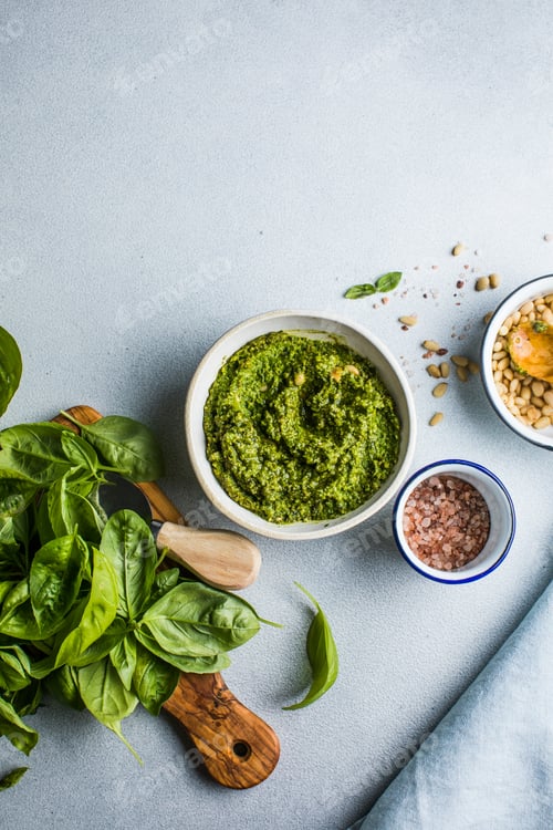 Preview: Pesto sause and ingredients on white background, copy space