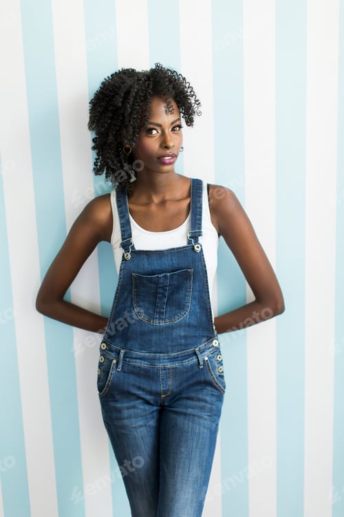 Preview: Woman posing by the wall