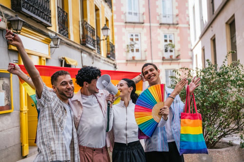 Preview: Diverse friends celebrating lgbtq plus pride in madrid street
