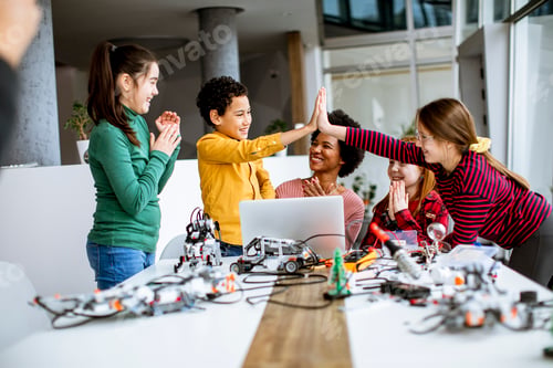 Preview: happy kids with their African American female science teacher