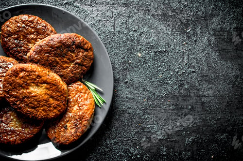 Preview: Cutlets on a plate with rosemary.