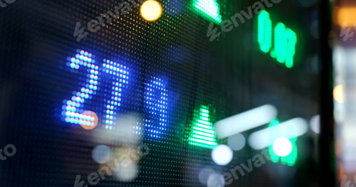 Preview: Display of Stock market quotes with city scene reflect on glass