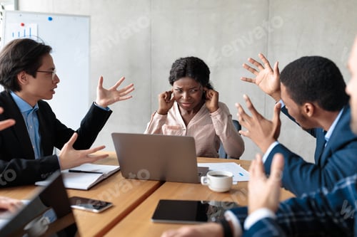 Preview: Angry Colleagues Shouting At Female Manager During Meeting In Office