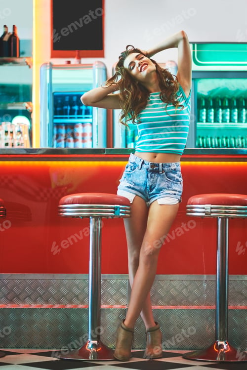 Preview: Going back in time and enjoying the day. Shot of a beautiful young woman in a diner.