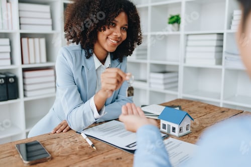 Preview: Female African american Real estate company to buy houses and land are delivering keys and houses