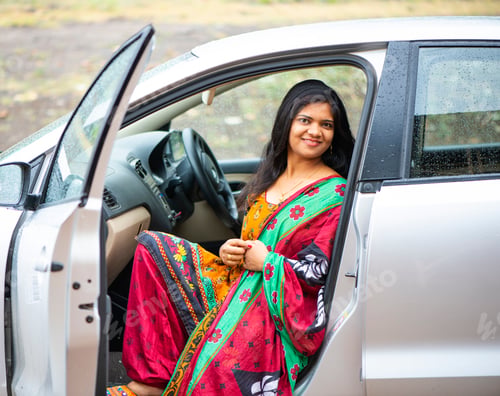Preview: Portrait of Indian woman sitting in a car