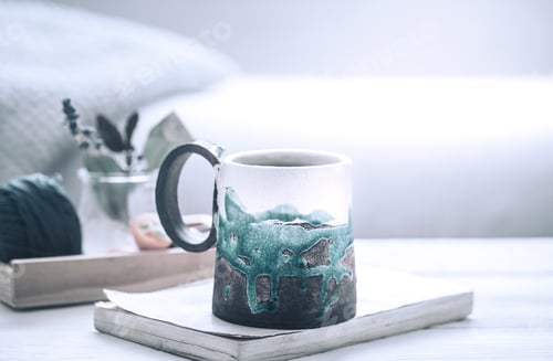 Preview: book and a cup of tea on a wooden background