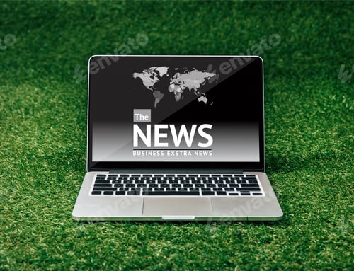Preview: close up view of opened laptop with news on screen