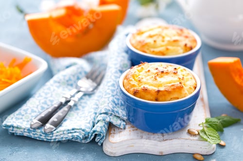 Preview: Delicious mini casserole with cottage cheese and pumpkin for breakfast. White background. Closeup