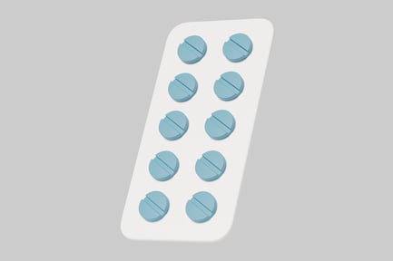 Preview: Blue pills in a white rectangular pill package.