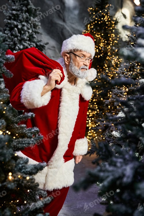Preview: Santa Claus joyfully prepares for Christmas amidst twinkling lights and festive trees