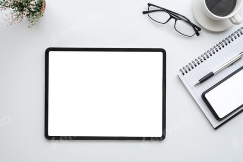 Preview: White office desk with smartphone tablet white screen empty at the office. Mock up.