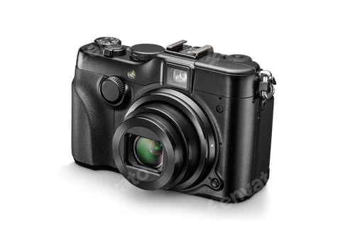 Preview: Black digital compact photo camera with open lens. Front view, isolated on white.