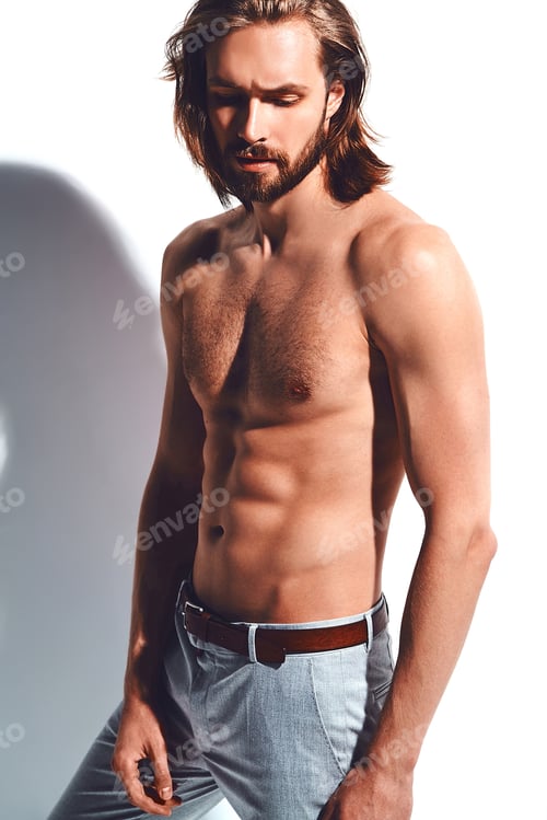 Preview: Portrait of young handsome man posing in studio