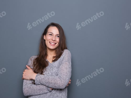 Smiling Woman in Gray Sweater Posing Indoors