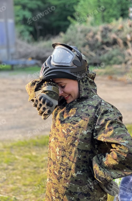 Preview: A young woman in military uniform rests after sports training