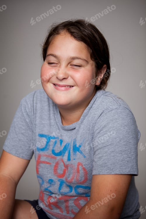 Preview: Studio portrait of girl with eyes closed wearing tshirt