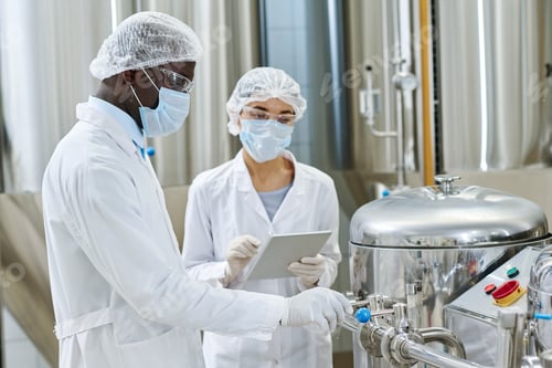 Preview: Couple of engineers controlling the work of machinery