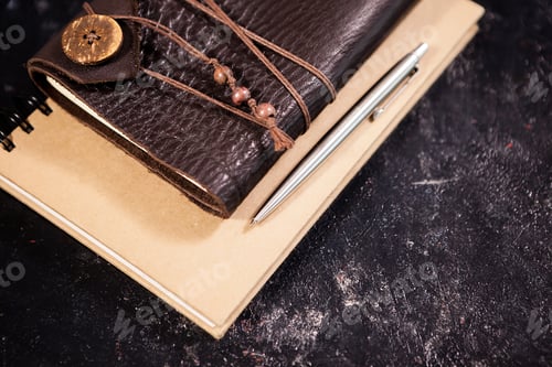 Preview: Top view on aged retro notebook with leather cover