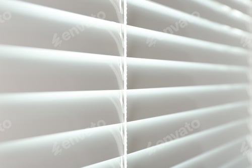 Preview: Closed modern white window blinds, closeup view