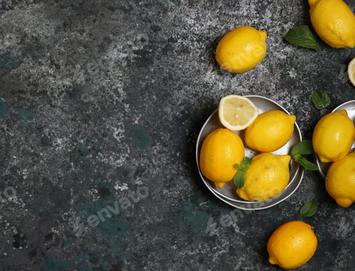 Preview: organic lemons on gray stone background
