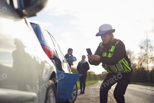 Preview: Female Traffic Police Officer Taking Photos On Mobile Phone At Road Traffic Accident