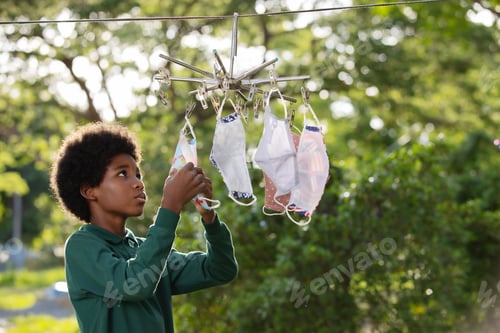 Preview: Africa children boy hanging the reusable fabric protective face masks