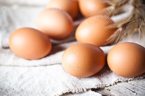 Preview: fresh brown eggs and wheat ears