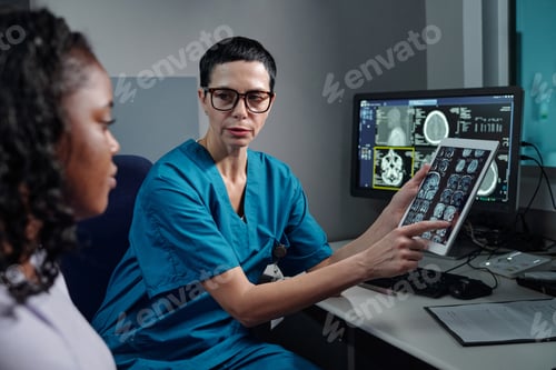 Preview: Nurse Explaining MRI Results using Digital Tablet