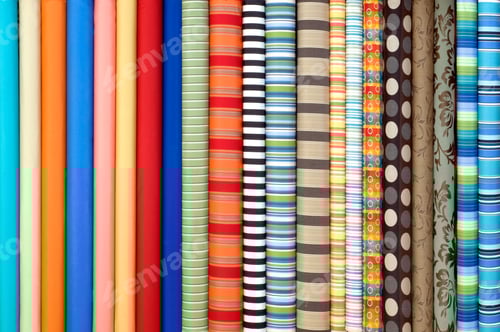 Preview: Colorful Rolls of Fabric with Varied Patterns