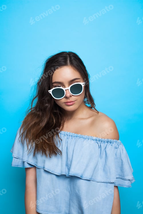 Preview: Attractive girl looking over sunglasses