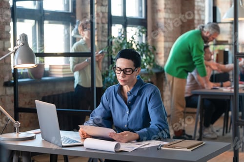Preview: Businesswoman working with documents at office