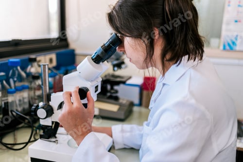 Preview: Female Scientist Using Microscopy in Laboratory